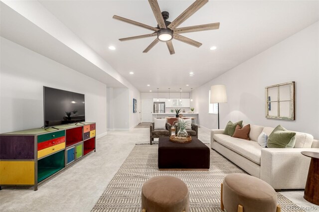 7202 S Valleyhead Ct, Aurora, CO 80016 - living area featuring light colored carpet, a ceiling fan, baseboards, and recessed lighting