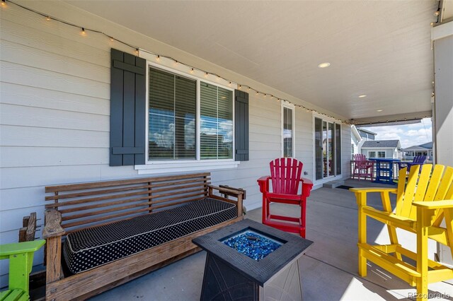 7202 S Valleyhead Ct, Aurora, CO 80016 - view of patio / terrace featuring an outdoor fire pit and covered porch