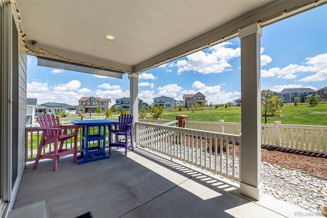 7202 S Valleyhead Ct, Aurora, CO 80016 - view of patio featuring a residential view