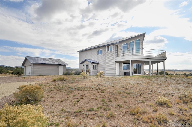 rear view of property with a balcony