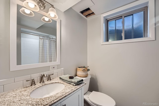 1465 S Urban Way, Lakewood, CO 80228 - bathroom featuring vanity, a shower with shower curtain, and toilet