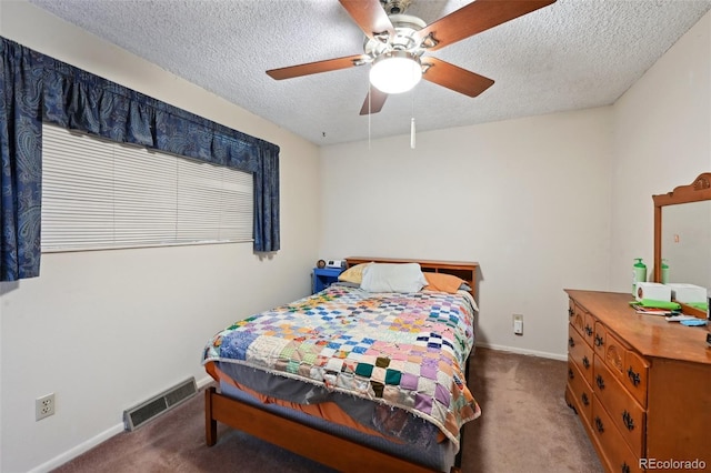 carpeted bedroom with baseboards, a ceiling fan, a textured ceiling, and visible vents