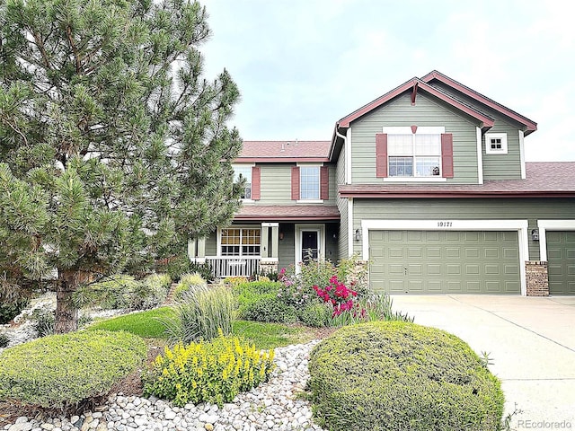 view of front of home featuring a garage and a porch