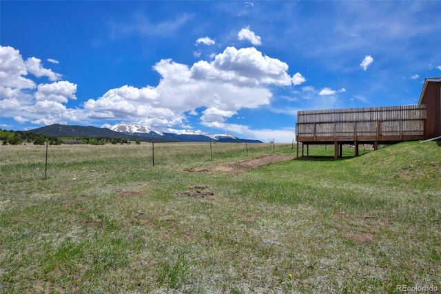 view of yard with a mountain view and a rural view