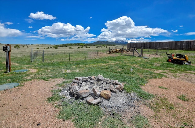 view of yard featuring a mountain view and a rural view