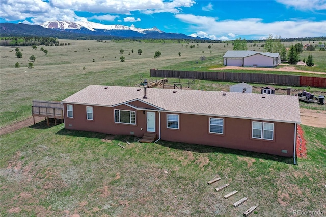 drone / aerial view with a mountain view and a rural view