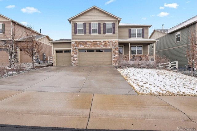 view of front of property featuring a garage, stone siding, covered porch, and concrete driveway