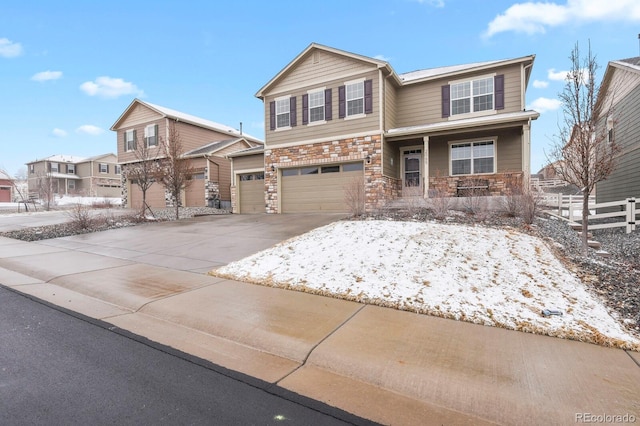 view of front of property with a porch, stone siding, a garage, and driveway