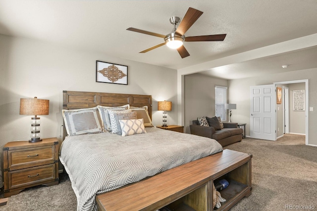 carpeted bedroom with baseboards and ceiling fan