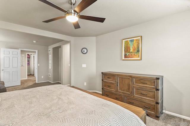 carpeted bedroom with baseboards and ceiling fan