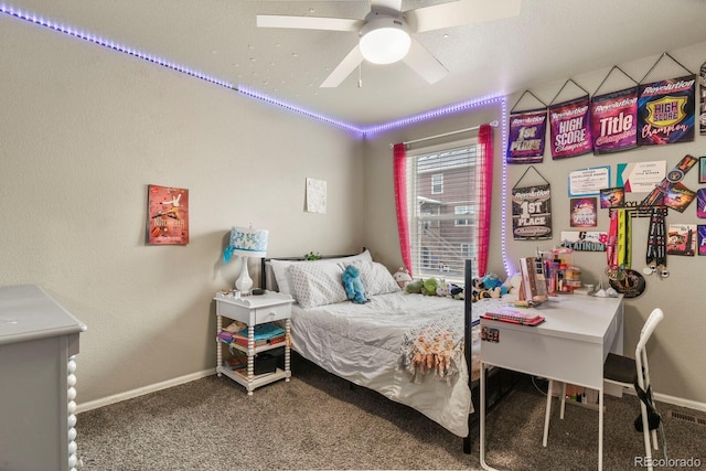 bedroom featuring ceiling fan, baseboards, and carpet floors