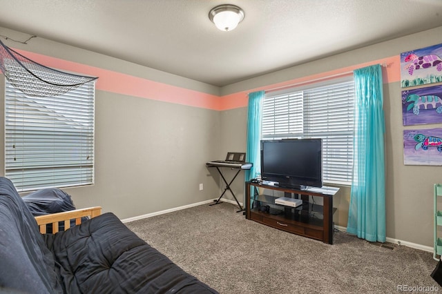 living area with carpet flooring and baseboards