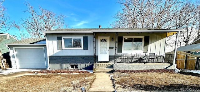 view of front of house featuring a porch and a garage