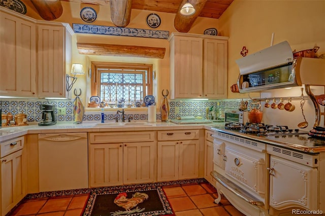 kitchen with sink, light tile patterned floors, backsplash, white dishwasher, and beamed ceiling