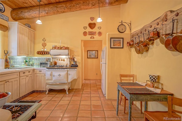 kitchen featuring beamed ceiling, wood ceiling, white fridge, pendant lighting, and backsplash