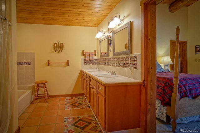 bathroom with backsplash, a tub to relax in, vanity, wood ceiling, and tile patterned floors