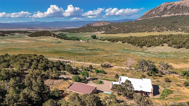 aerial view featuring a rural view and a mountain view