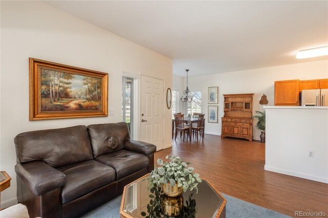 8775 W Berry Ave Unit 101, Littleton, CO 80123 - living room with baseboards and dark wood finished floors
