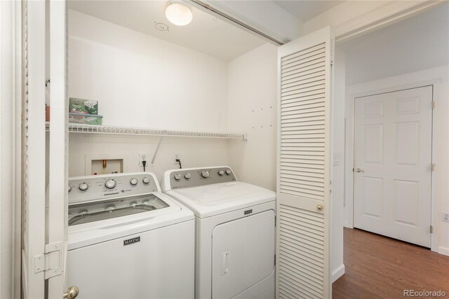 8775 W Berry Ave Unit 101, Littleton, CO 80123 - laundry area featuring wood finished floors, washing machine and clothes dryer, and laundry area