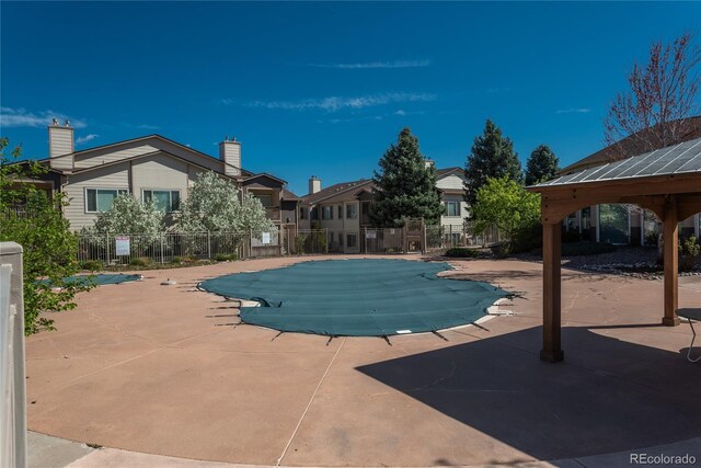 8775 W Berry Ave Unit 101, Littleton, CO 80123 - pool featuring fence and a patio