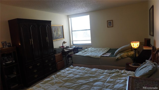 bedroom featuring a textured ceiling