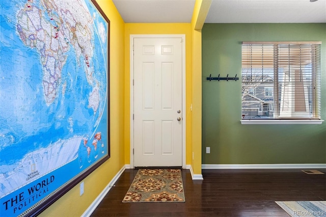 entrance foyer with dark hardwood / wood-style floors