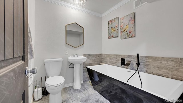 12020 W Alabama Pl, Lakewood, CO 80228 - bathroom with a freestanding bath, ornamental molding, and wood finished floors