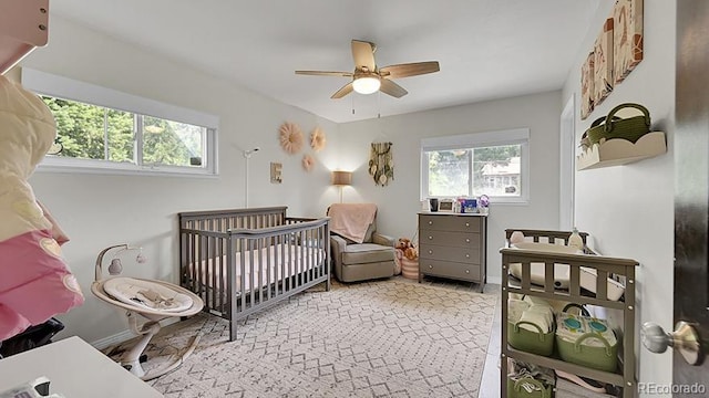 12020 W Alabama Pl, Lakewood, CO 80228 - bedroom featuring a crib and ceiling fan