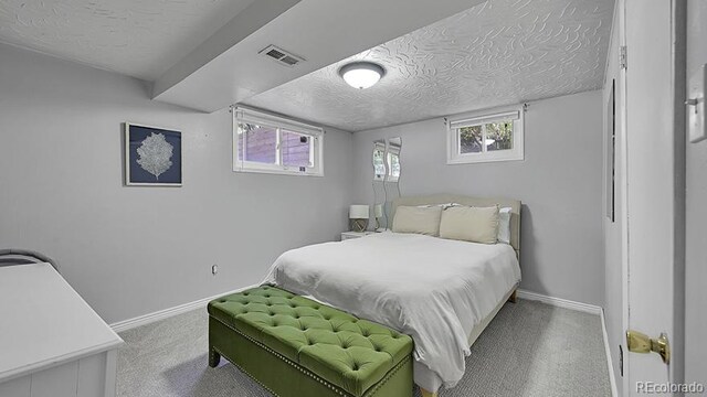 12020 W Alabama Pl, Lakewood, CO 80228 - carpeted bedroom featuring a textured ceiling