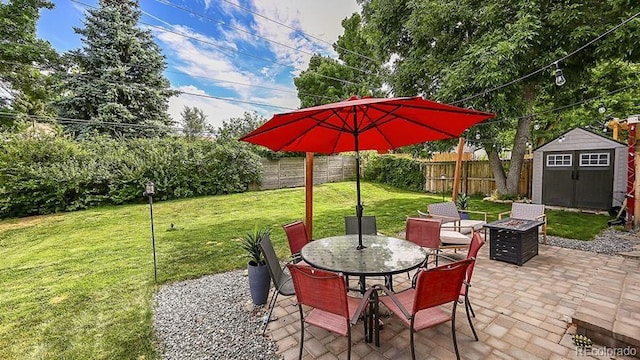 12020 W Alabama Pl, Lakewood, CO 80228 - fenced backyard with a shed, a patio, a fire pit, and outdoor dining area