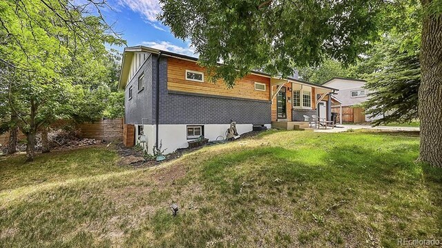12020 W Alabama Pl, Lakewood, CO 80228 - view of front of property with a patio area and entry steps