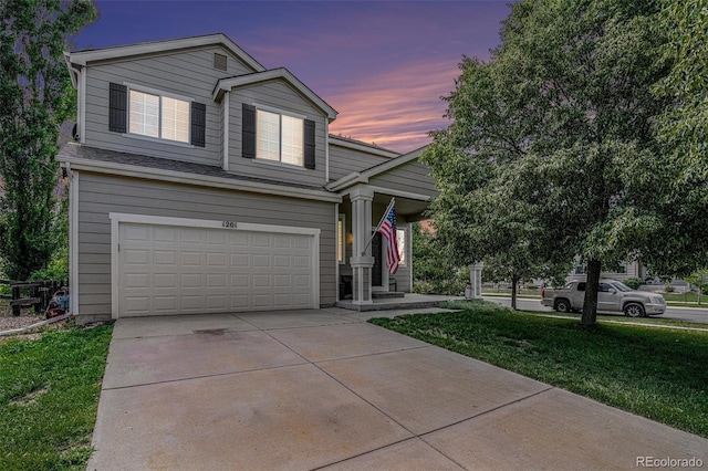 1201 102nd Ave, Greeley, CO 80634 - view of front of home with a garage, driveway, and a front yard