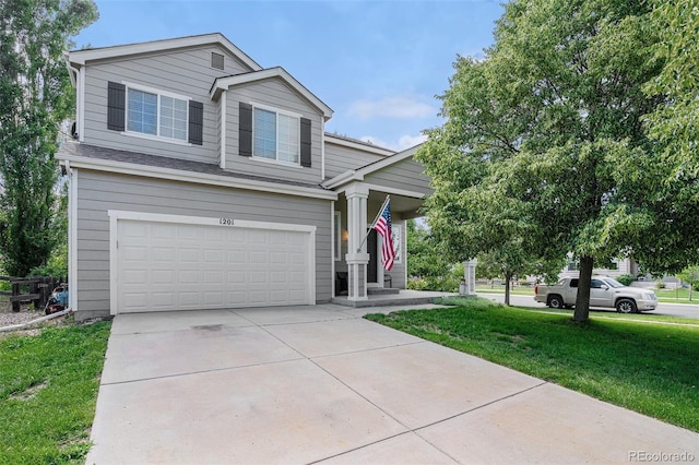1201 102nd Ave, Greeley, CO 80634 - view of front of house featuring a garage, a front yard, and driveway