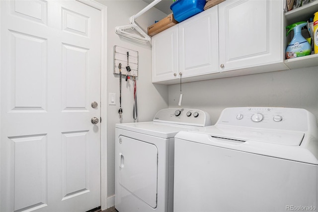 1201 102nd Ave, Greeley, CO 80634 - laundry area featuring separate washer and dryer and cabinet space