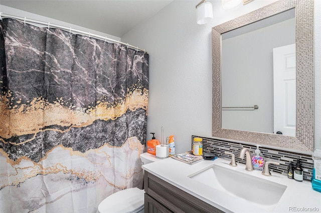 1201 102nd Ave, Greeley, CO 80634 - full bathroom featuring vanity, backsplash, and a shower with shower curtain
