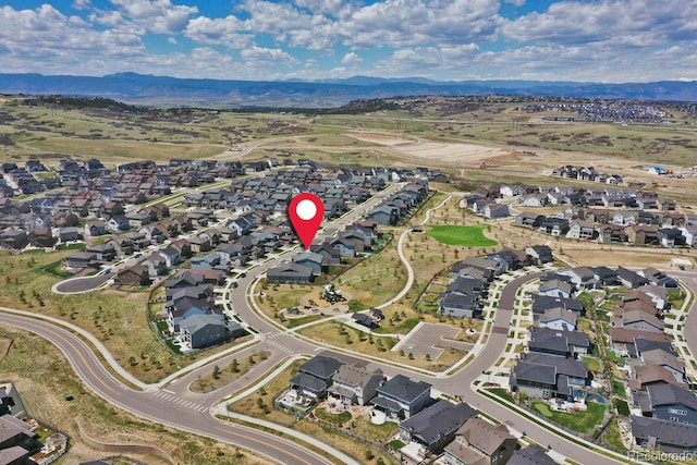 birds eye view of property with a residential view and a mountain view