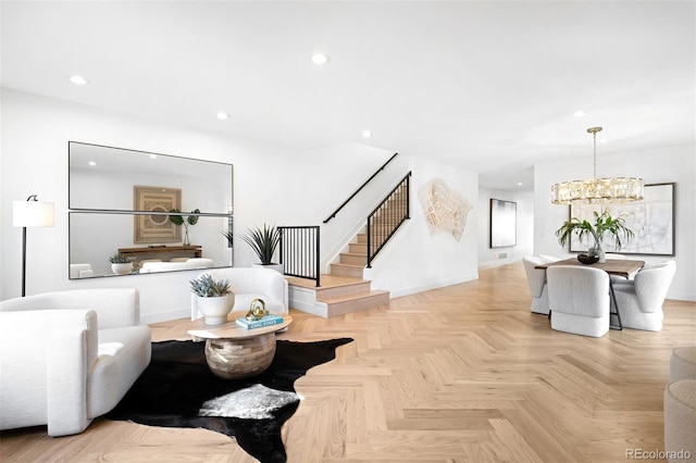 living area with stairs, an inviting chandelier, recessed lighting, and baseboards