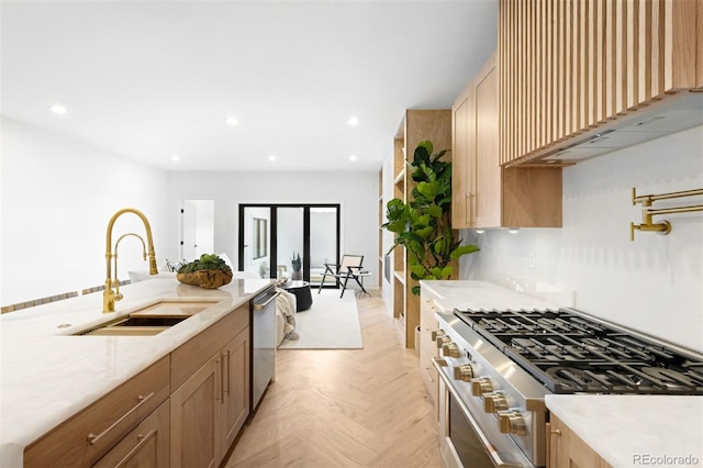 kitchen featuring a sink, stainless steel appliances, custom exhaust hood, and recessed lighting