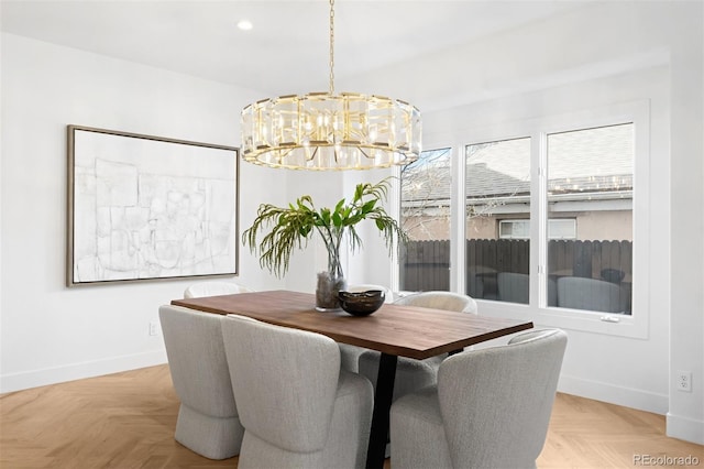 dining room with recessed lighting, an inviting chandelier, and baseboards