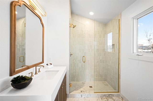 bathroom featuring a shower stall and vanity