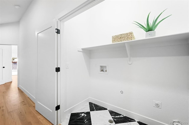 laundry room with washer hookup, laundry area, and baseboards