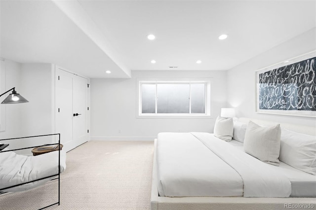 bedroom featuring recessed lighting, baseboards, light carpet, and visible vents