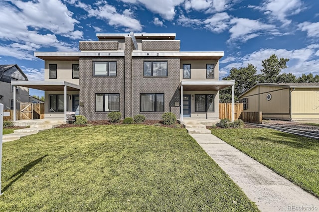 view of front of property with a front yard and a porch