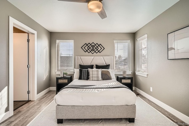 bedroom featuring ceiling fan and light hardwood / wood-style flooring