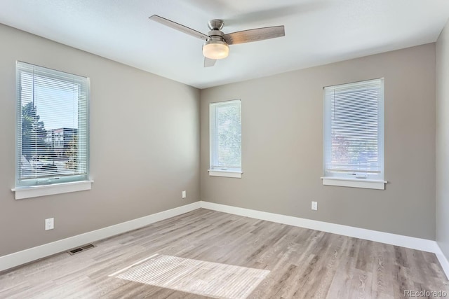 unfurnished room with light hardwood / wood-style flooring and ceiling fan