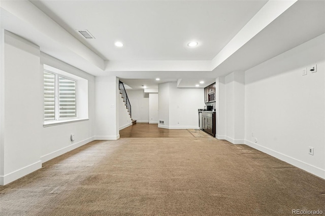 3941 Vallejo St, Denver, CO 80211 - basement featuring stairs, light colored carpet, baseboards, recessed lighting, and bar