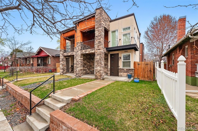 3941 Vallejo St, Denver, CO 80211 - contemporary house featuring a balcony, stone siding, and stucco siding