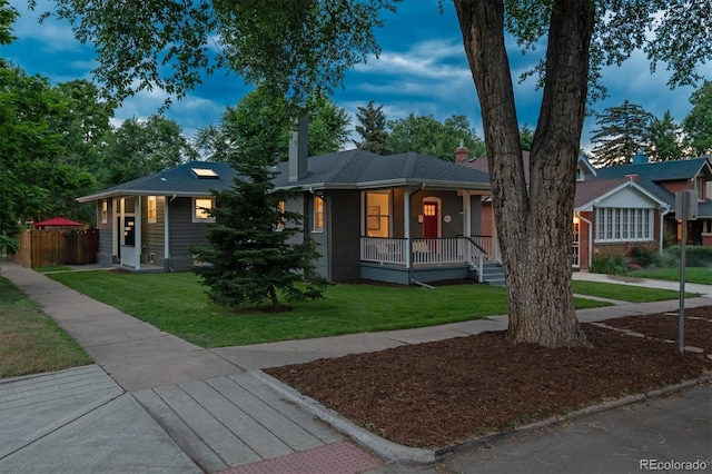 1895 S Emerson St, Denver, CO 80210 - ranch-style home with covered porch and a chimney