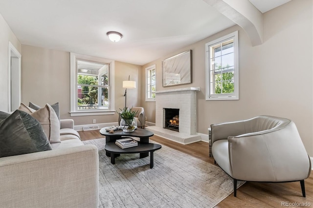1895 S Emerson St, Denver, CO 80210 - living room with a brick fireplace and wood finished floors