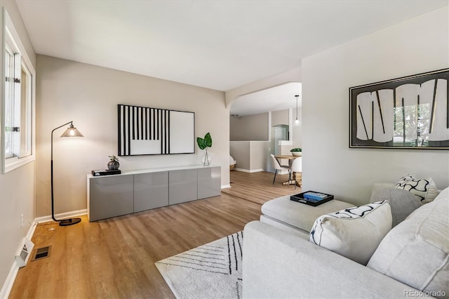 1895 S Emerson St, Denver, CO 80210 - living area with wood finished floors and arched walkways